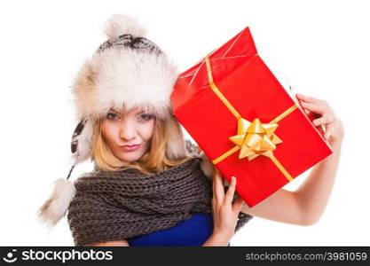 Christmas holidays valentine&rsquo;s day, celebration and happy people concept - blonde girl in winter fur hat with red gift box present isolated