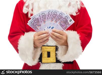 christmas, holidays, winning, currency and people concept - close up of santa claus with euro money