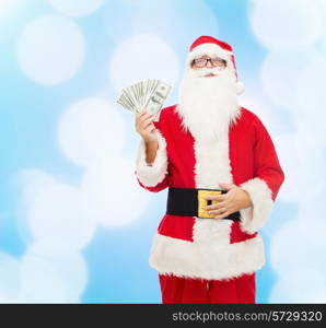 christmas, holidays, winning, currency and people concept - man in costume of santa claus with dollar money over blue lights background