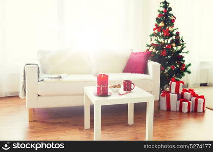 christmas, holidays, winter, home and still life concept - living room interior with christmas tree and gifts. living room interior with christmas tree and gifts