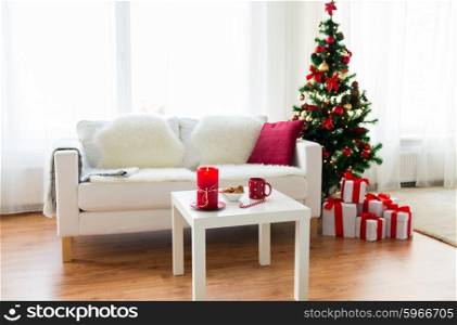 christmas, holidays, winter, home and still life concept - living room interior with christmas tree and gifts