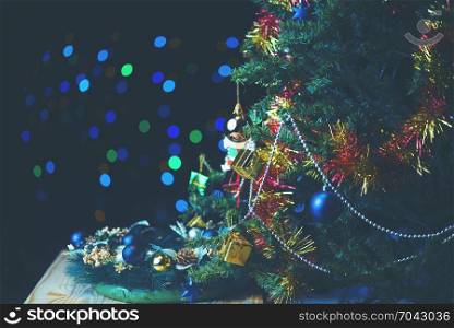 Christmas home room with tree and festive bokeh lighting, blurred holiday background