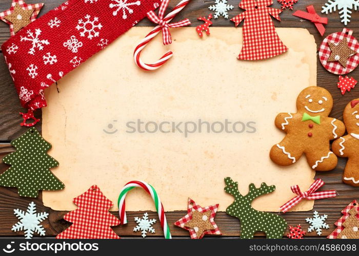 Christmas homemade gingerbread cookie and handmade decoration on wooden background