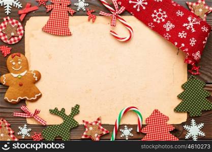 Christmas homemade gingerbread cookie and handmade decoration on wooden background