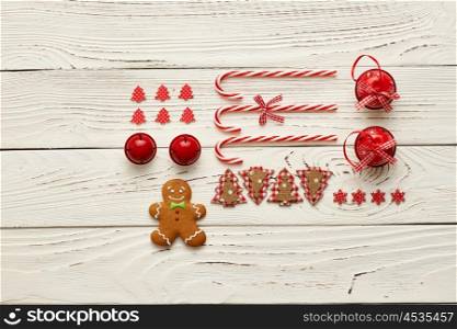 Christmas homemade gingerbread cookie and handmade decoration on wooden background flat lay still life