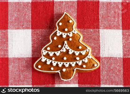 Christmas homemade gingerbread cookie on tablecloth