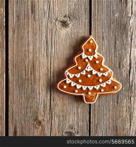 Christmas homemade gingerbread cookie on wooden table