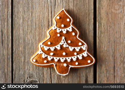 Christmas homemade gingerbread cookie on wooden table