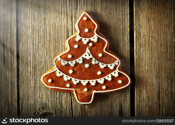 Christmas homemade gingerbread cookie on wooden table