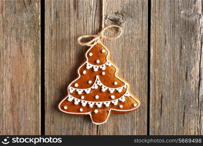 Christmas homemade gingerbread cookie over wooden background