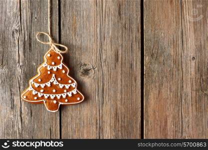 Christmas homemade gingerbread cookie over wooden background