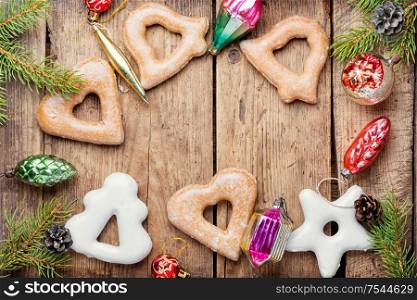 Christmas homemade gingerbread cookies and bauble.Winter holidays background. Christmas gingerbread and decoration