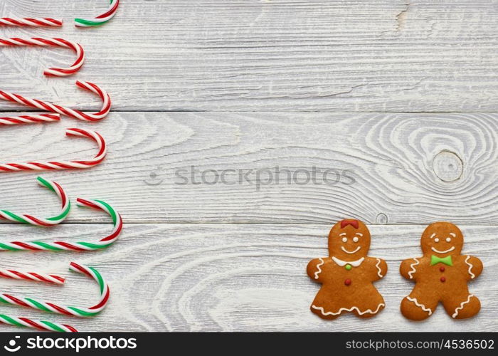 Christmas homemade gingerbread cookies and decoration on wooden background