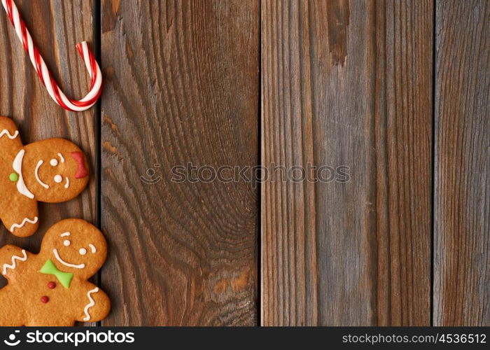 Christmas homemade gingerbread cookies and decoration on wooden background