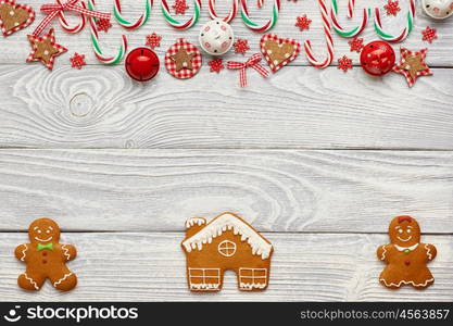 Christmas homemade gingerbread cookies and decoration on wooden background