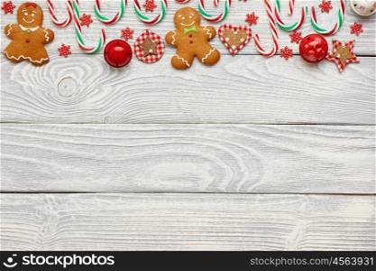 Christmas homemade gingerbread cookies and decoration on wooden background