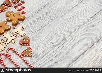 Christmas homemade gingerbread cookies and decoration on wooden background