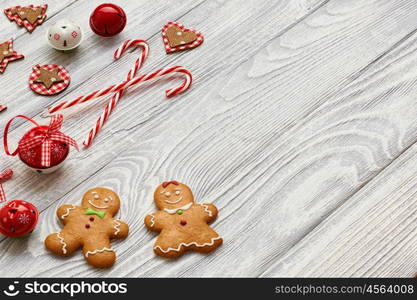 Christmas homemade gingerbread cookies and decoration on wooden background