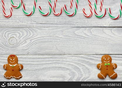 Christmas homemade gingerbread cookies and decoration on wooden background