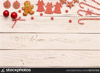 Christmas homemade gingerbread cookies and decoration on wooden background