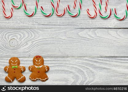 Christmas homemade gingerbread cookies and decoration on wooden background