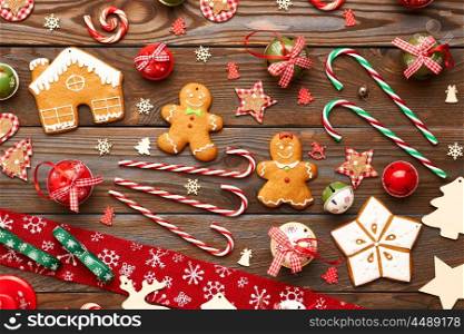 Christmas homemade gingerbread cookies and handmade decoration on wooden background