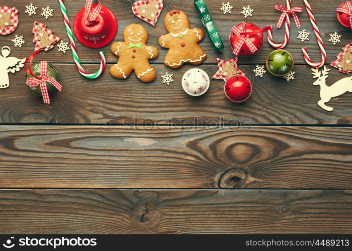 Christmas homemade gingerbread cookies and handmade decoration on wooden background