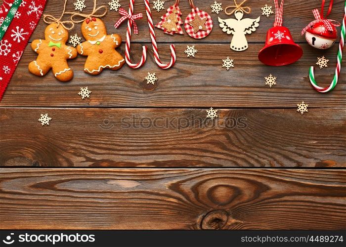 Christmas homemade gingerbread cookies and handmade decoration on wooden background