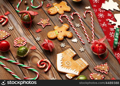 Christmas homemade gingerbread cookies and handmade decoration on wooden background