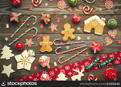 Christmas homemade gingerbread cookies and handmade decoration on wooden background