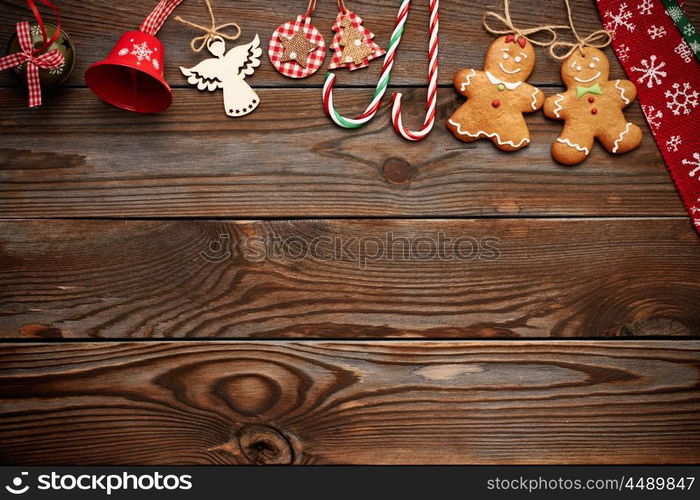 Christmas homemade gingerbread cookies and handmade decoration on wooden background