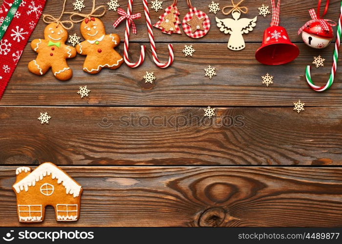 Christmas homemade gingerbread cookies and handmade decoration on wooden background