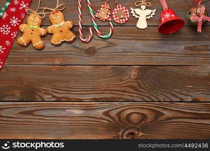 Christmas homemade gingerbread cookies and handmade decoration on wooden background