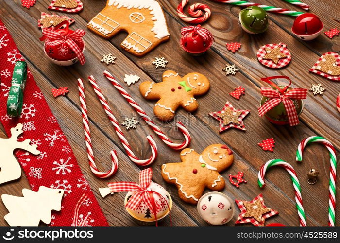 Christmas homemade gingerbread cookies and handmade decoration on wooden background