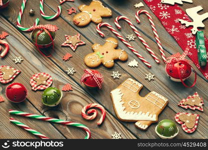 Christmas homemade gingerbread cookies and handmade decoration on wooden background