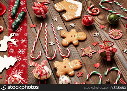 Christmas homemade gingerbread cookies and handmade decoration on wooden background