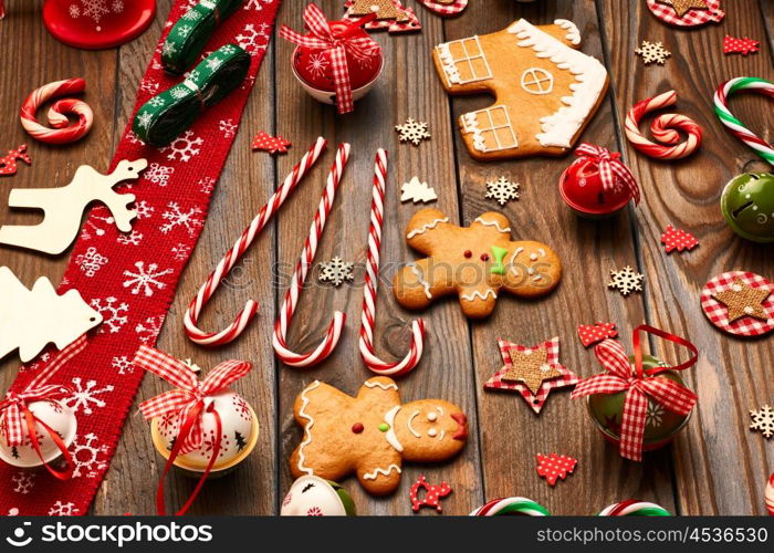 Christmas homemade gingerbread cookies and handmade decoration on wooden background