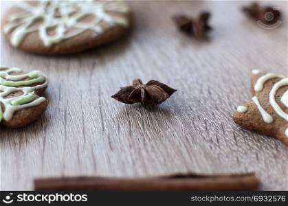 Christmas homemade gingerbread cookies on a wooden table. Anise star spice.