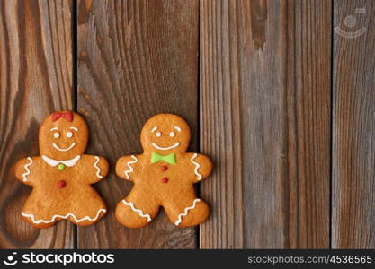 Christmas homemade gingerbread cookies on wooden background