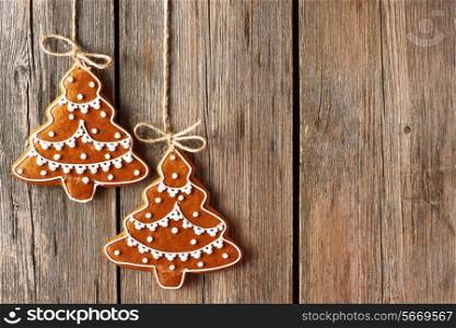 Christmas homemade gingerbread cookies over wooden background