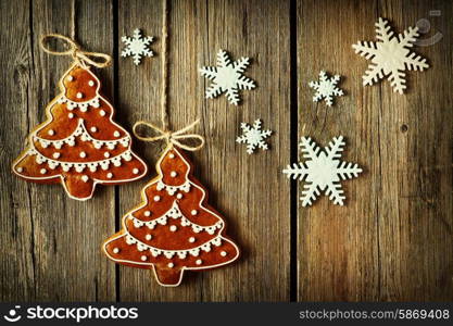 Christmas homemade gingerbread cookies over wooden background