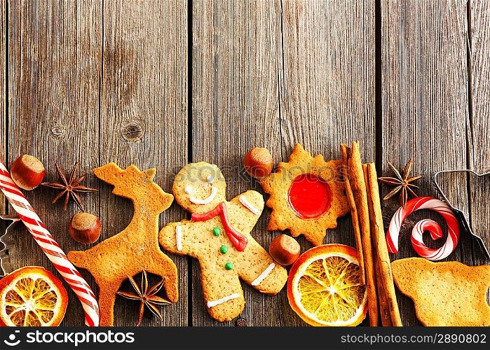 Christmas homemade gingerbread cookies over wooden table