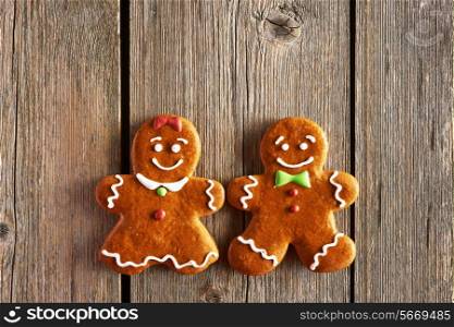 Christmas homemade gingerbread couple cookies on wooden table
