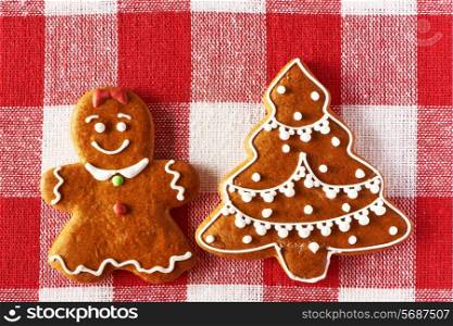 Christmas homemade gingerbread girl on tablecloth
