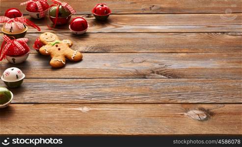 Christmas homemade gingerbread man cookie and decoration on wooden background