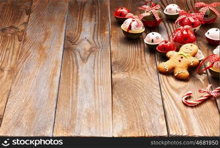 Christmas homemade gingerbread man cookie and decoration on wooden background