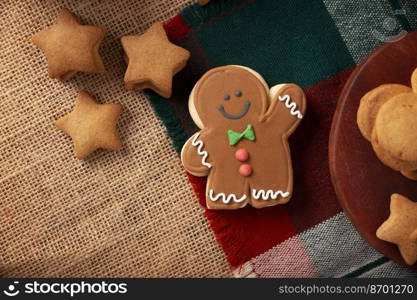 Christmas Homemade gingerbread man cookies, traditionally made at wintertime and the holidays. Table top view.