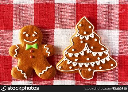 Christmas homemade gingerbread man on tablecloth