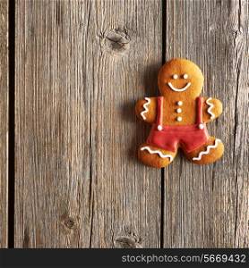 Christmas homemade gingerbread man on wooden table