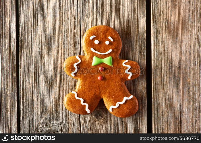 Christmas homemade gingerbread man on wooden table